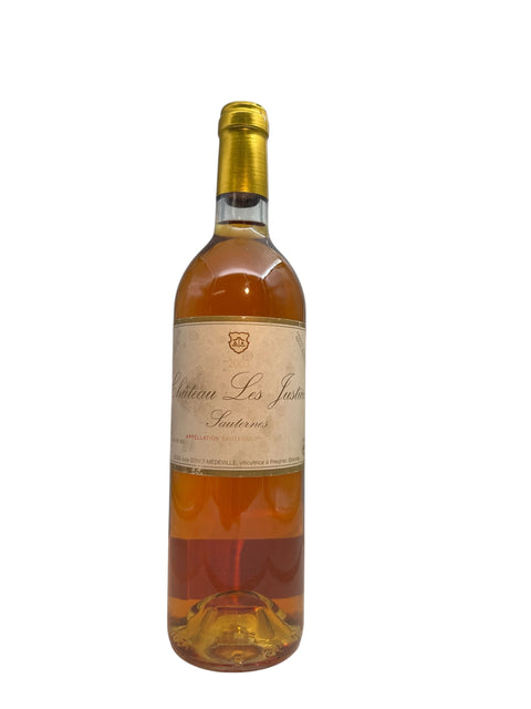 Château Les Justices 2005 flaske med gylden dessertvin