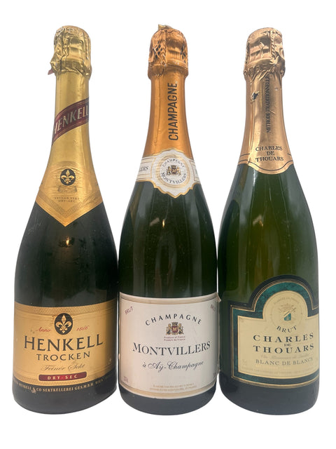 Tre flasker champagne med forskellige etiketter