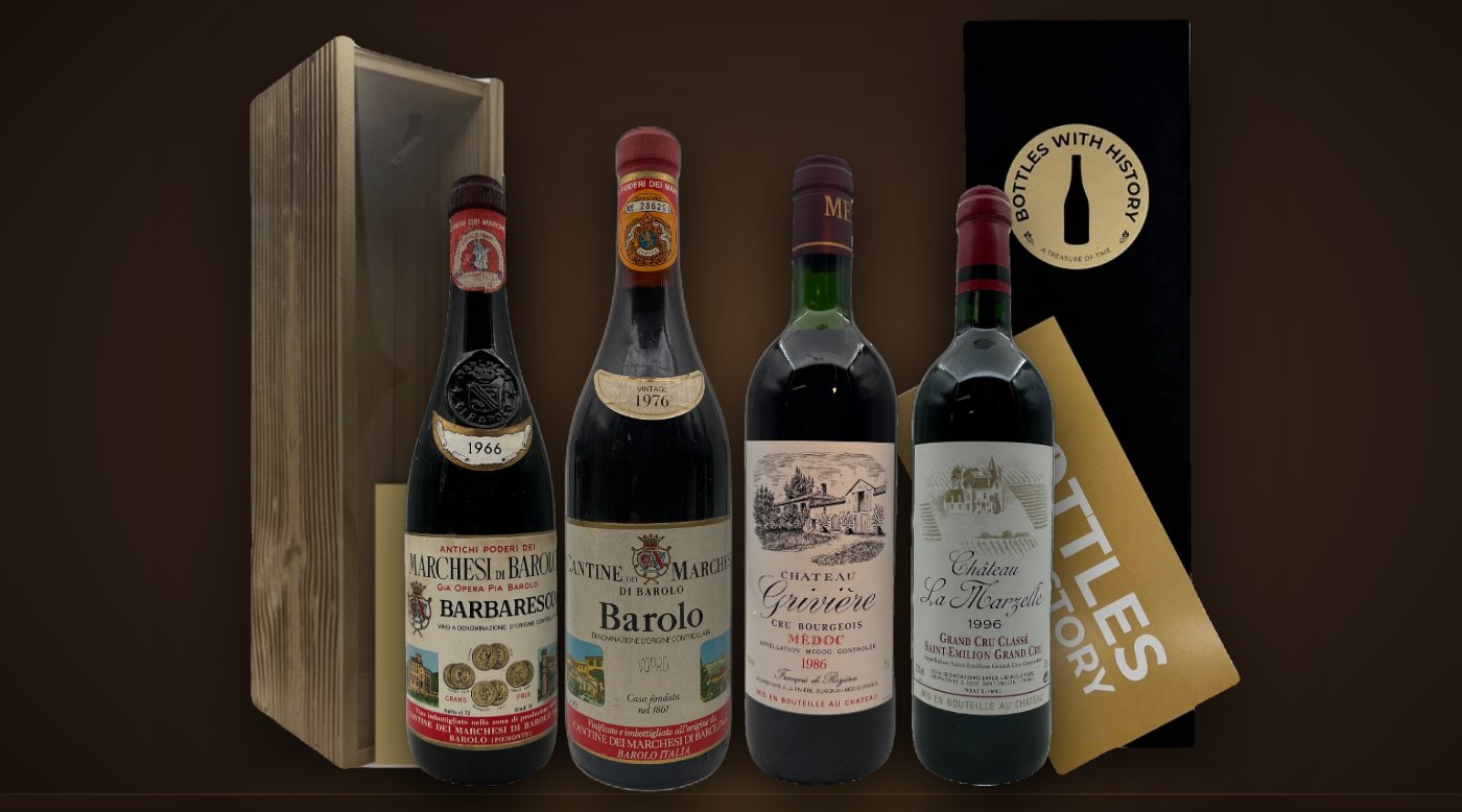 Jaargangwijnen uit 1966, 1976, 1986 en 1996 voor geschenkdozen van Bottles With History in hout en zwart